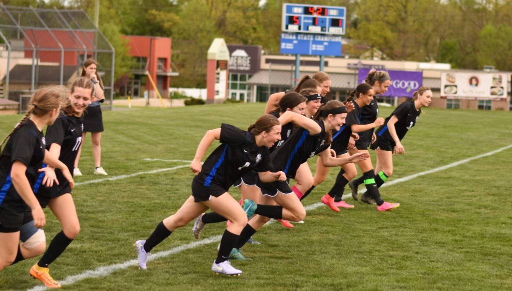 State Champion Varsity Girls Soccer
team warming up for a game.