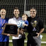 Curt Stutzman, assistant coach; Andrew Gascho, head coach, Forrest and Dave Bechler , athletic director, after the girls varsity state championship title game, 2015 championship plaque for girls soccer, 2015