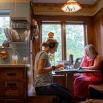 Michaela Mast '13  and Harrison Horst  prepare to interview Wendy Chappell-Dick in Bluffton, Ohio, for the podcast, Shifting Climates. Photo by Sarah Longenecker