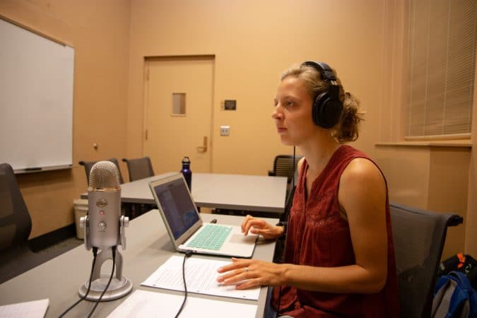 Michaela Mast '13, recording the podcast, Shifting Climates. Photo by Sarah Longenecker