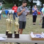 Andrew Gascho reading out awardee names at the  2019 EMHS cross country invitational at Peak View.