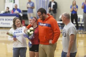 Joshua Stapleton '18, surprised is sister Abby '20, for senior day