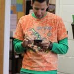 Athletic Director Andrew Gascho, checking some stats on tie dye day during spring 2019 spiit week.