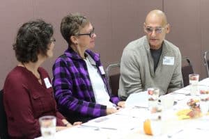 Herb Weaver '75, ceramist who created the award gifts, and wife Anita, '76, talk with Mary Leaman