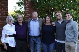 Kirsten Nafziger '89 Moore, third from right, with her family, including parents Helen and Ken Nafziger, husband Chris, and sons Max and Simon