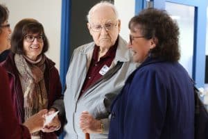 Lyle Burkholder '44 (center)