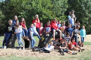 Middle school science students helped install tires for the new EMES playground.