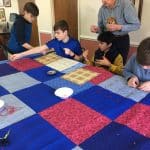 Seventh grade class. Comforter knotting for Mennonite Central Committee at Virginia Mennonite Retirement Community.