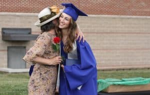 Marsha Thomas, admissions counselor, greets her daughter Sophie, commencemnt 2021