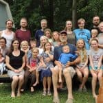 Kathryn and John Fairfield (center), with their four sons, daughters-in-law, and grandchildren