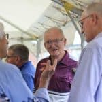 Visiting at the picnic with former faculty and staff: Dave Mumaw, Jim Rush (center) and Eric Martin