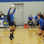 2015 volleyball match with Gene Meiser at the clock and microphone