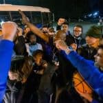 Fans and team members huddle up to celebrate state championship Flames. Photo by Daniel Lin/DN-R