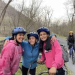 Girls pose on biking trail