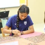 Bible 9 students knot comforters for Mennonite Central Committee