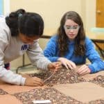 Bible 9 students knot comforters for Mennonite Central Committee