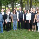 Six EMHS grads were fortunate to sing in Jay Hartzler's first Touring Choir in 1981-82 and see their children sing in his final choir 34 years later. Pictured left to right at the 2015 final Touring Concert concert at Weaver's Mennonite Church