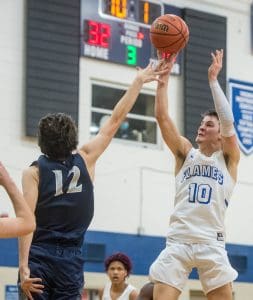 Eastern Mennonite's Trey Gillenwater goes up for a shot against Covenant's Beck Garber.