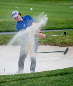 Eastern Mennonite's Ryan Slonaker hits out of a bunker.
