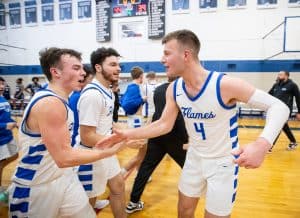 Eastern Mennonite's Drew Hatter, right, celebrates with Ethan Hildebrand after their victory over Carmel.